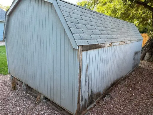 Weathered peeling blue shed before painting, Elements Painting project on the Colorado Front Range