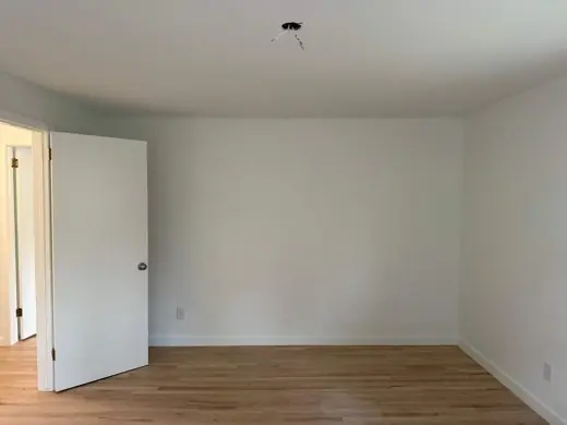 White painted room with door and light oak floor, Elements Painting project on the Colorado Front Range