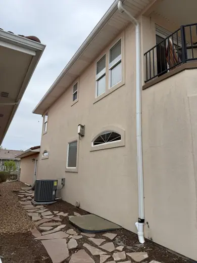 White stucco home with balcony railing, Elements Painting project on the Colorado Front Range