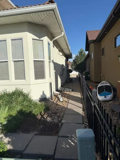 White stucco home with brown trim and windows, Elements Painting project on the Colorado Front Range
