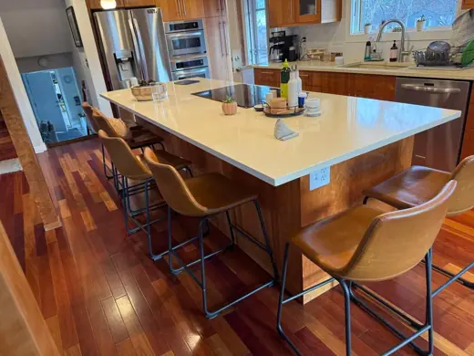 Wood kitchen island with white top and leather stools, Elements Painting project on the Colorado Front Range